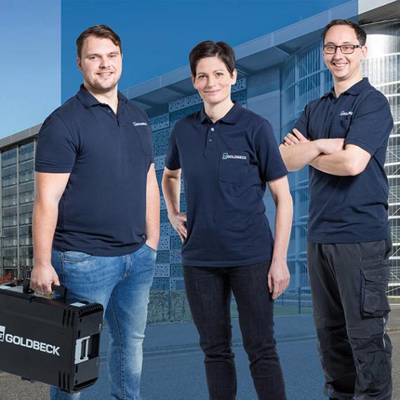 Employees in front of building