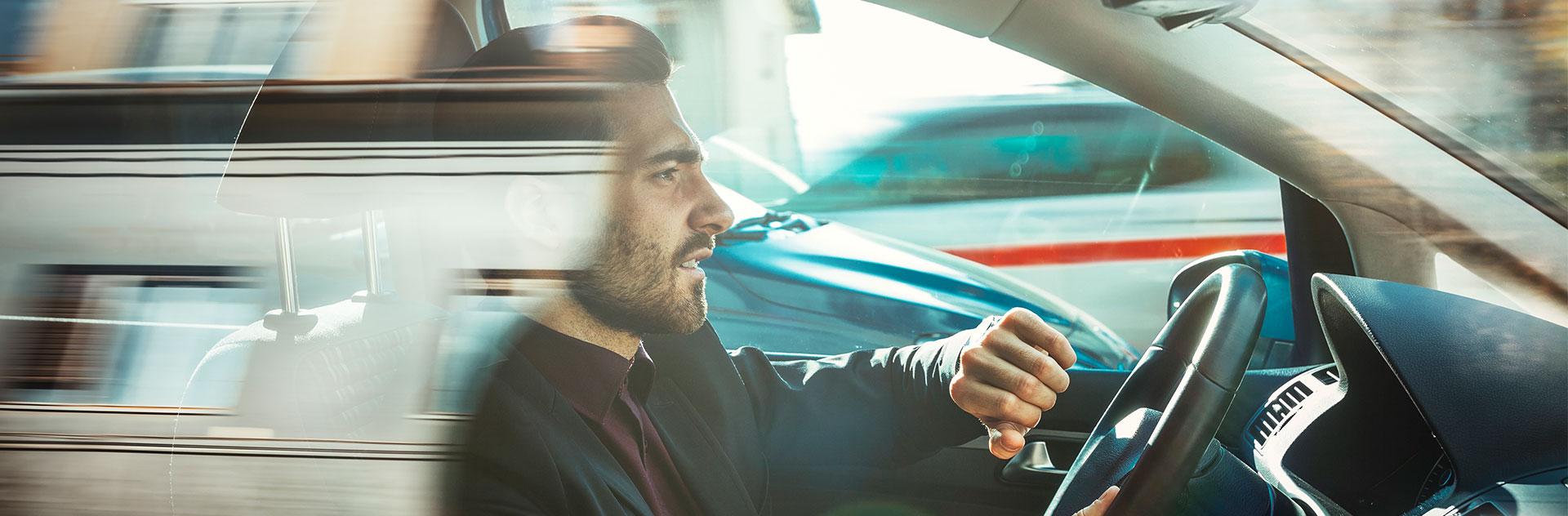 Annoyed Man in the traffic jam looking at his wristwatch